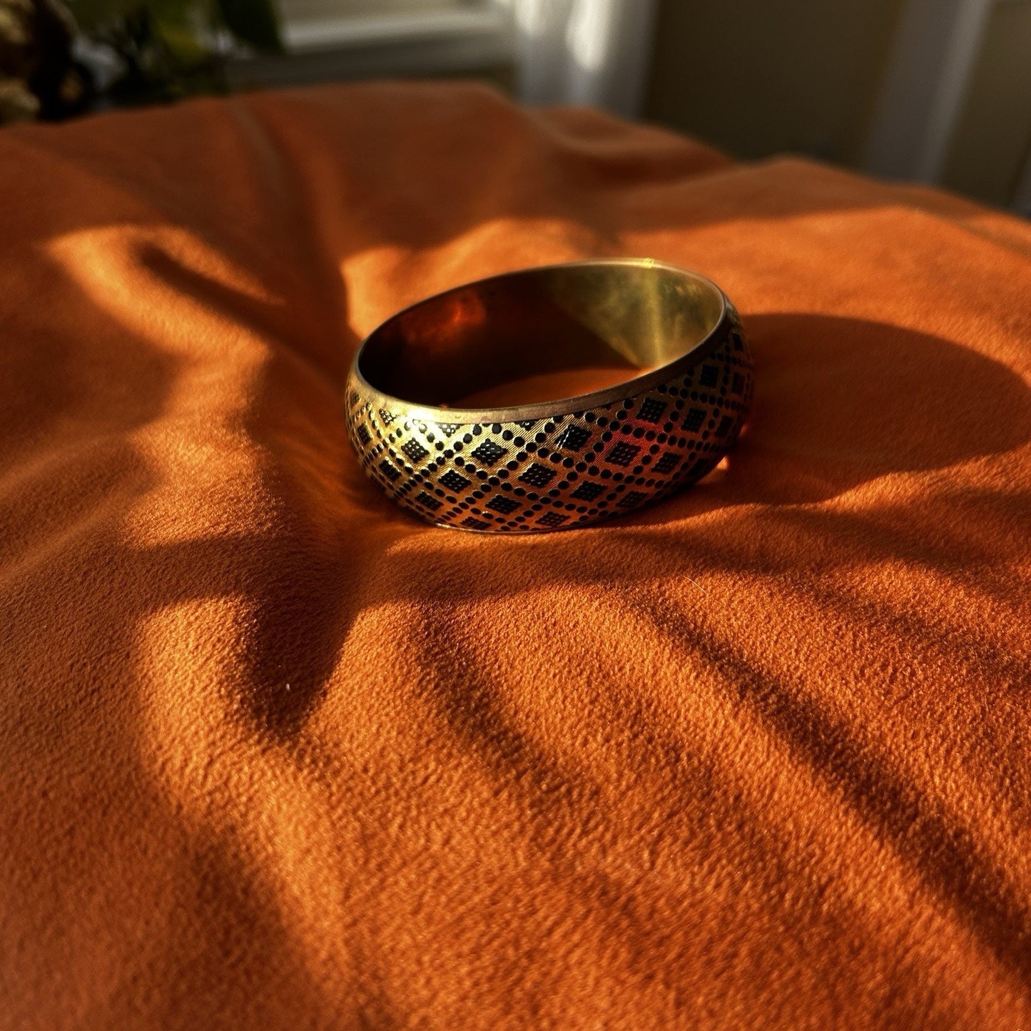 Gold Tone Patterned Metal Bangle Bracelet with Black Design