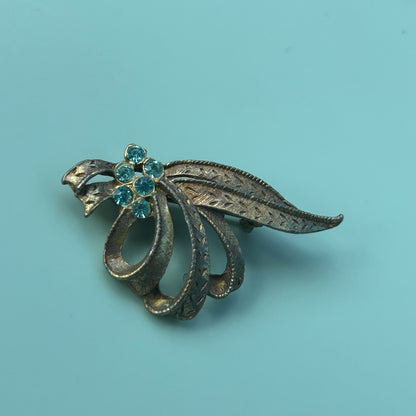 Vintage Gold-Tone Textured Ribbon Bow Brooch with Light Blue Rhinestone Accents