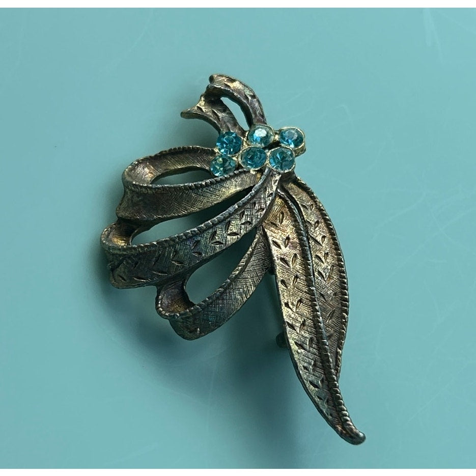 Vintage Gold-Tone Textured Ribbon Bow Brooch with Light Blue Rhinestone Accents