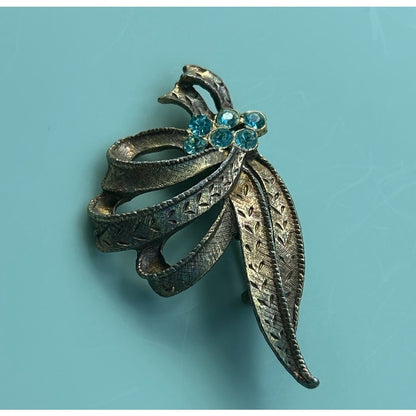 Vintage Gold-Tone Textured Ribbon Bow Brooch with Light Blue Rhinestone Accents