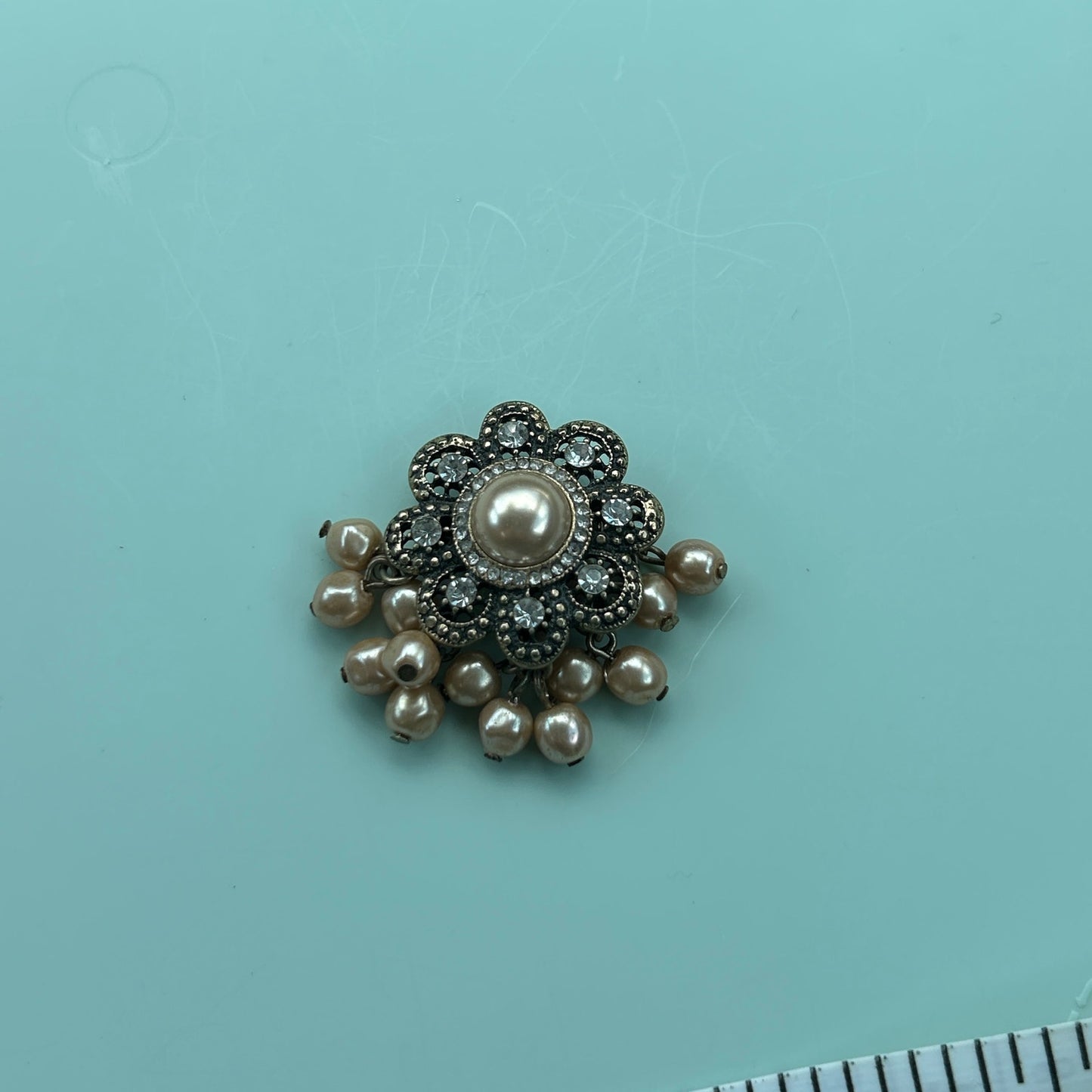 Antique Gold-Tone Floral Brooch with Rhinestones and Dangle Faux Pearls