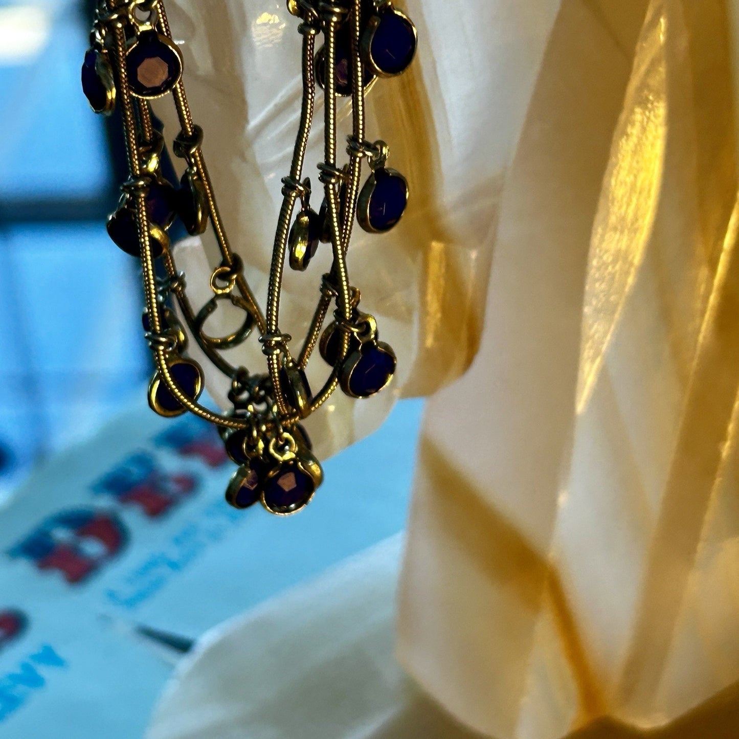 Gold Tone Multi-Strand Charm Bracelet with Blue Round Dangle Accents