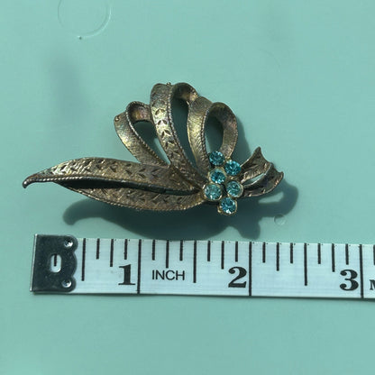 Vintage Gold-Tone Textured Ribbon Bow Brooch with Light Blue Rhinestone Accents