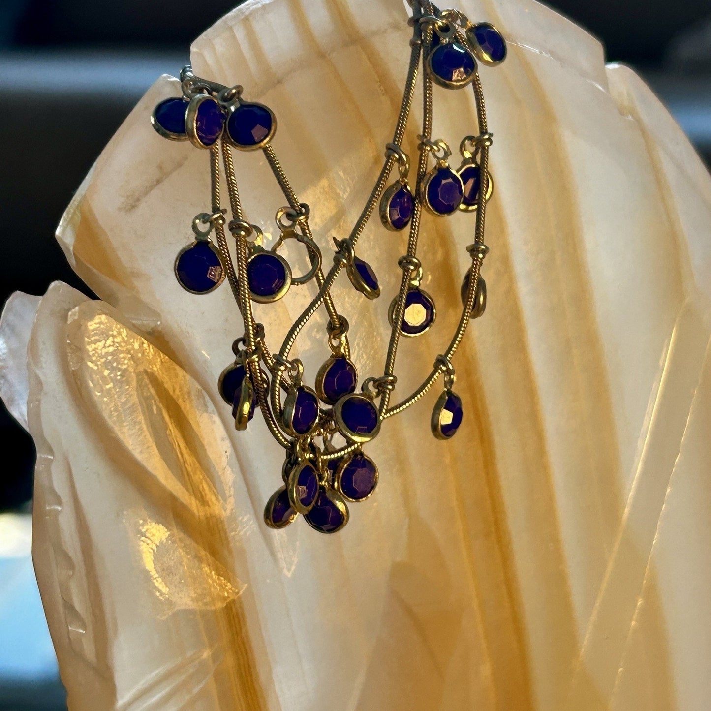 Gold Tone Multi-Strand Charm Bracelet with Blue Round Dangle Accents