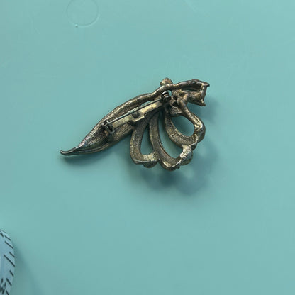 Vintage Gold-Tone Textured Ribbon Bow Brooch with Light Blue Rhinestone Accents