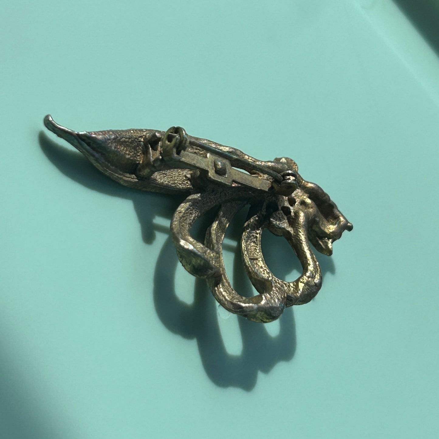 Vintage Gold-Tone Textured Ribbon Bow Brooch with Light Blue Rhinestone Accents