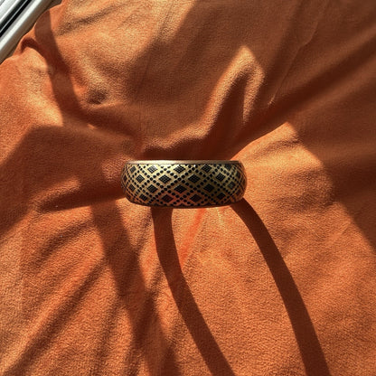 Gold Tone Patterned Metal Bangle Bracelet with Black Design