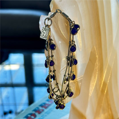 Gold Tone Multi-Strand Charm Bracelet with Blue Round Dangle Accents