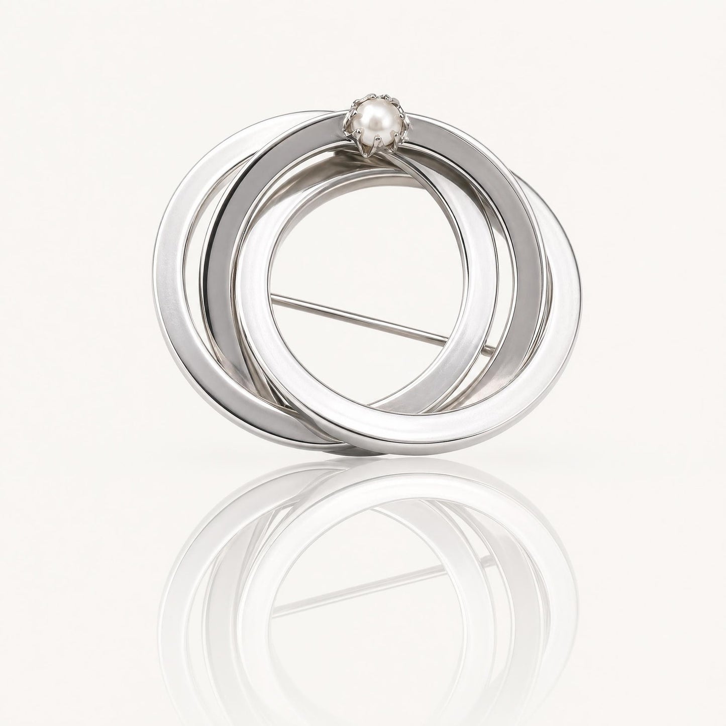 Vintage Silver Tone Triple Interlocking Circle Brooch with Faux Pearl Accent