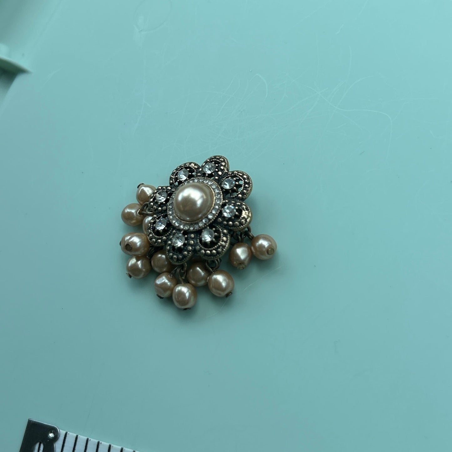 Antique Gold-Tone Floral Brooch with Rhinestones and Dangle Faux Pearls