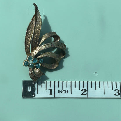 Vintage Gold-Tone Textured Ribbon Bow Brooch with Light Blue Rhinestone Accents