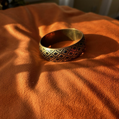 Gold Tone Patterned Metal Bangle Bracelet with Black Design