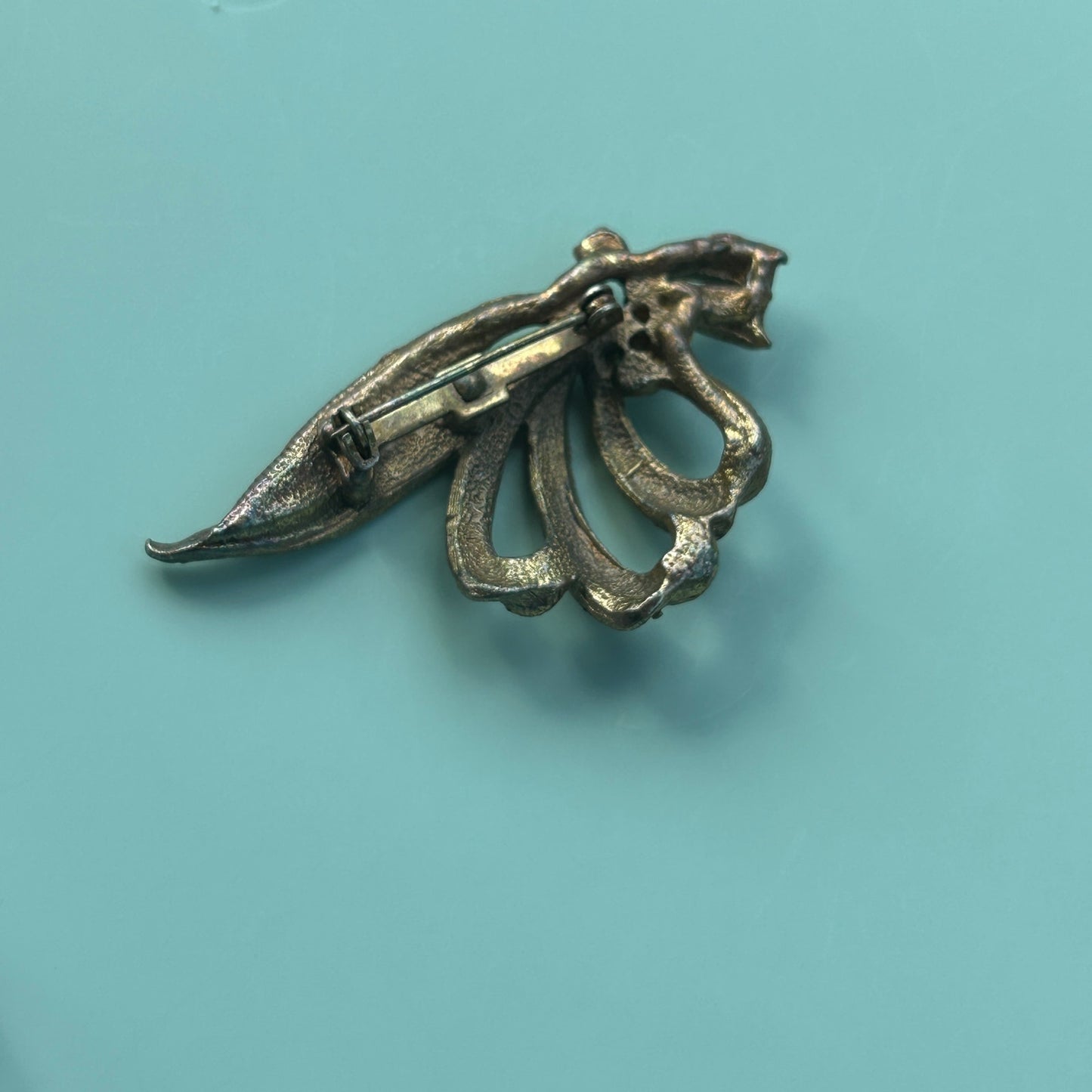 Vintage Gold-Tone Textured Ribbon Bow Brooch with Light Blue Rhinestone Accents