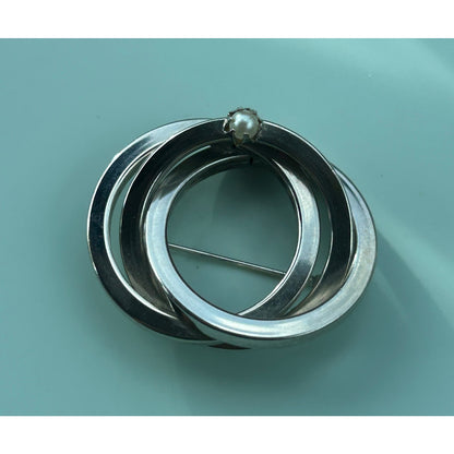 Vintage Silver Tone Triple Interlocking Circle Brooch with Faux Pearl Accent